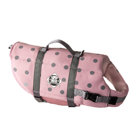 Pink and grey polka dot dog life jacket with reflective straps and top rescue handle. Paws Aboard logo on side of neoprene jacket centered between the straps.